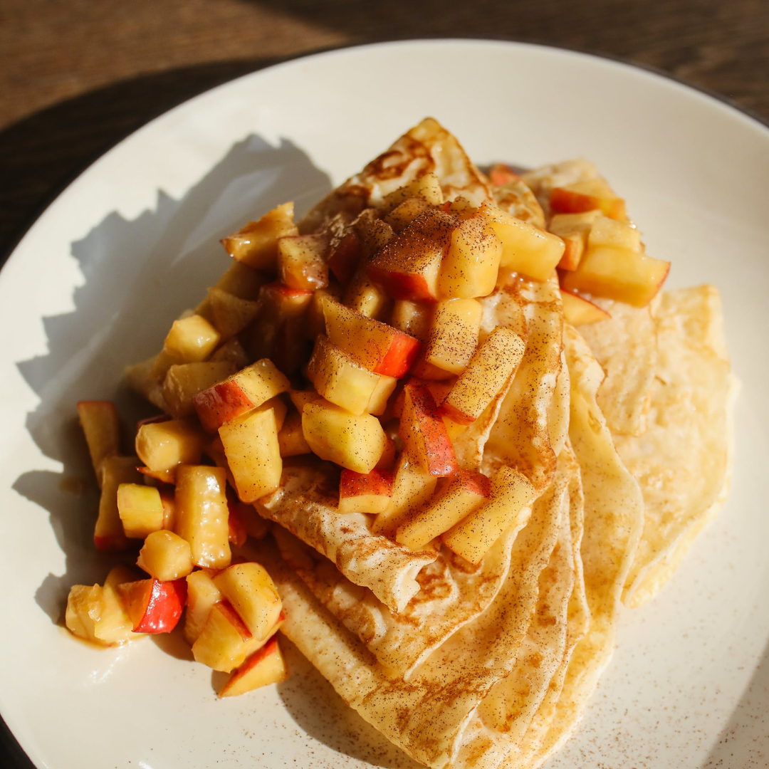 Cinnamon Apples placed on top of Crepes